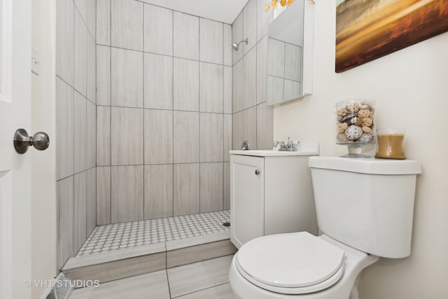 bathroom with tiled shower and toilet