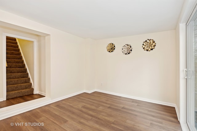 spare room with hardwood / wood-style flooring