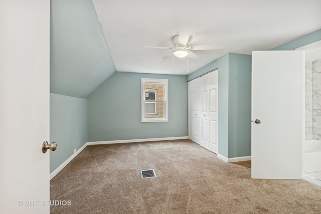 bonus room featuring ceiling fan, light colored carpet, and vaulted ceiling