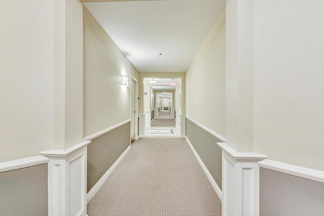 hallway with light carpet