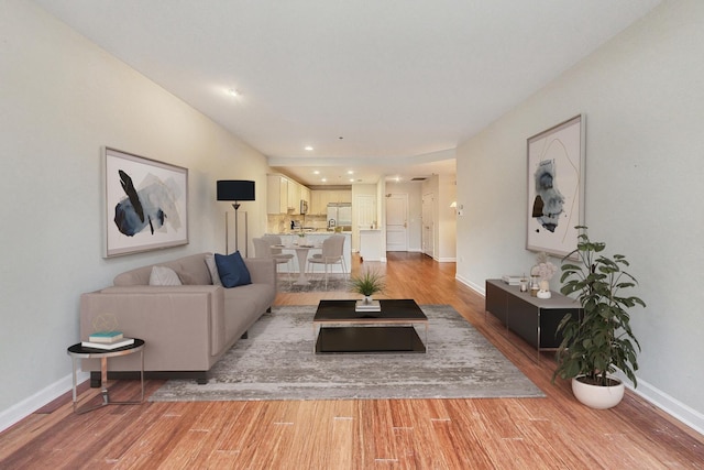 living room with light hardwood / wood-style floors