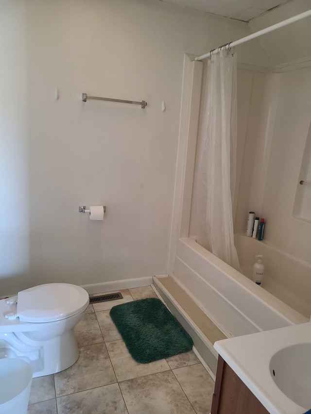 full bathroom featuring vanity, toilet, tile patterned floors, and shower / tub combo with curtain