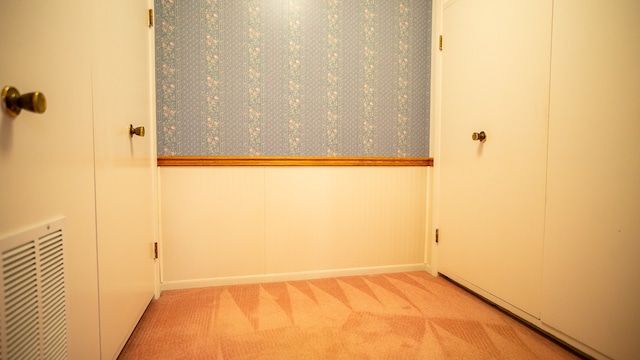 interior space featuring light colored carpet