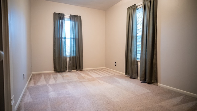 empty room with light colored carpet