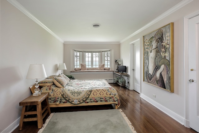 bedroom with dark hardwood / wood-style flooring and ornamental molding