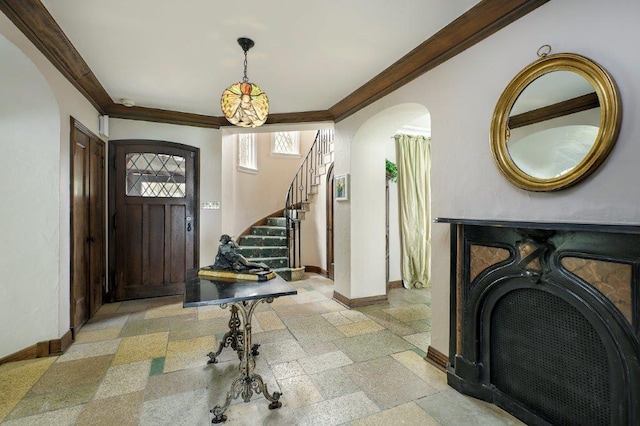 foyer featuring crown molding