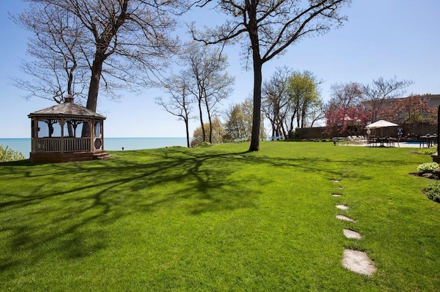 view of yard with a water view and a gazebo