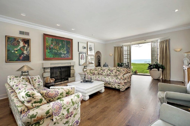 living room with ornamental molding and dark hardwood / wood-style floors