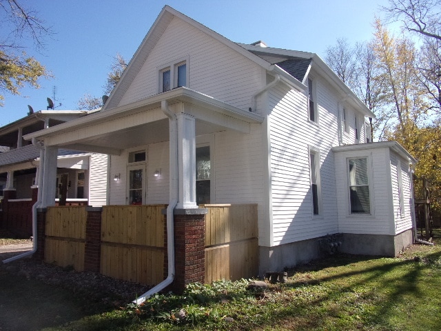 view of property exterior with a porch