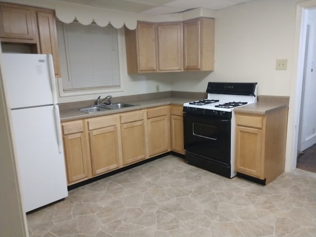 kitchen with white appliances, light brown cabinetry, and sink