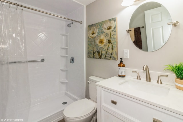 bathroom with toilet, vanity, and a shower with shower curtain