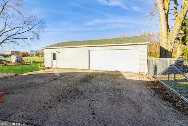 garage with a yard