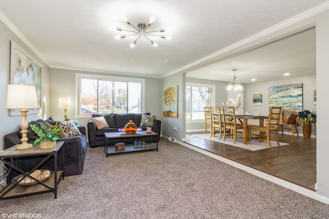 carpeted living room featuring a notable chandelier and ornamental molding