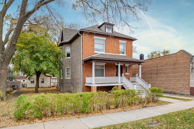 front of property featuring covered porch