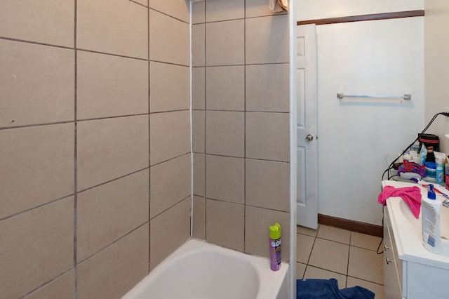 bathroom with vanity, tile patterned flooring, and a bathing tub