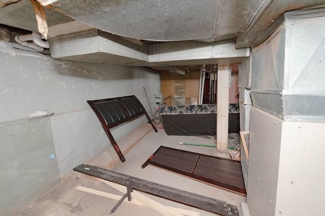 basement featuring heating unit