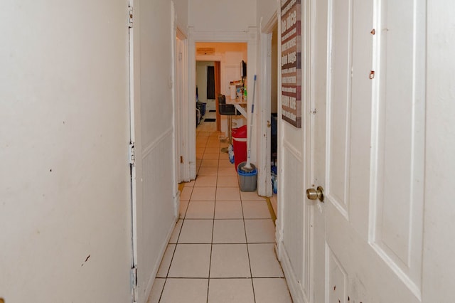 hallway with light tile patterned floors