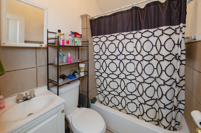 full bathroom featuring vanity, shower / tub combo with curtain, and toilet