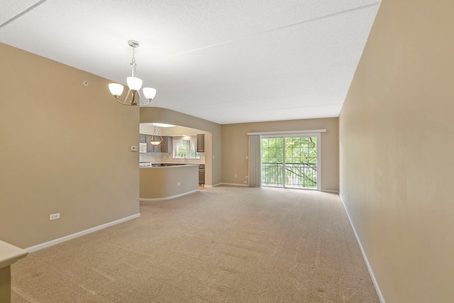 124 W Colfax St Unit 301, Palatine, IL 60067 - unfurnished living room featuring light colored carpet and a chandelier