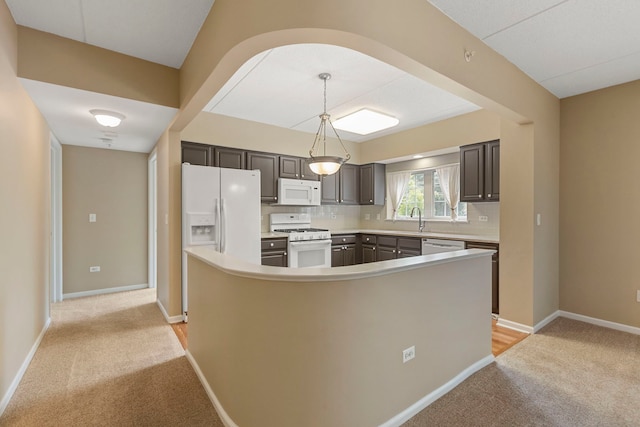 124 W Colfax St Unit 301, Palatine, IL 60067 - kitchen with white appliances, light colored carpet, decorative backsplash, and light countertops