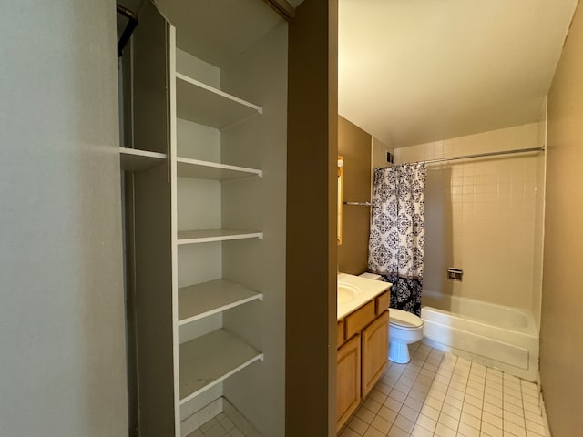 full bathroom featuring vanity, toilet, tile patterned floors, and shower / bath combo with shower curtain