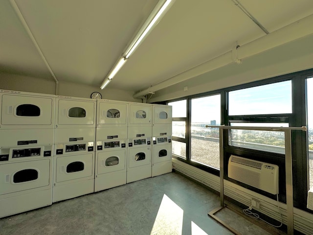 washroom featuring stacked washer and dryer and washer and clothes dryer