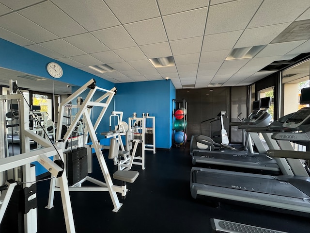 workout area with a paneled ceiling