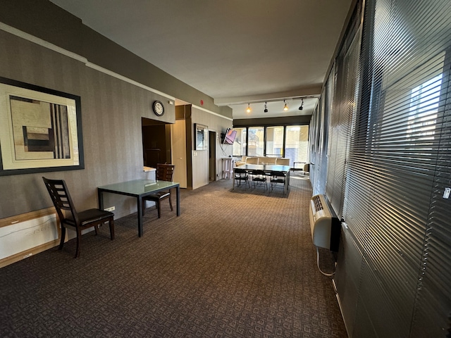 interior space featuring rail lighting and a wall mounted air conditioner