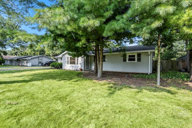 single story home featuring a front yard