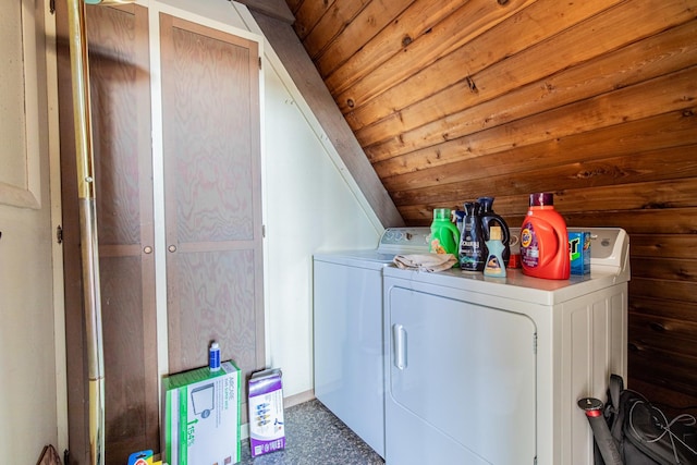 washroom featuring laundry area, wood ceiling, and separate washer and dryer