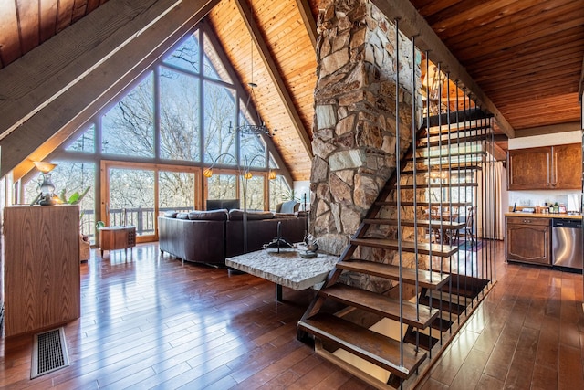 living room with visible vents, high vaulted ceiling, dark wood-style floors, wood ceiling, and stairs