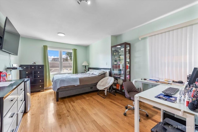 bedroom with light wood-style flooring