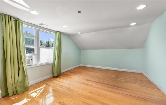 bonus room with vaulted ceiling, light wood-style flooring, recessed lighting, and baseboards