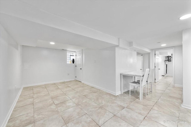 basement with recessed lighting and baseboards