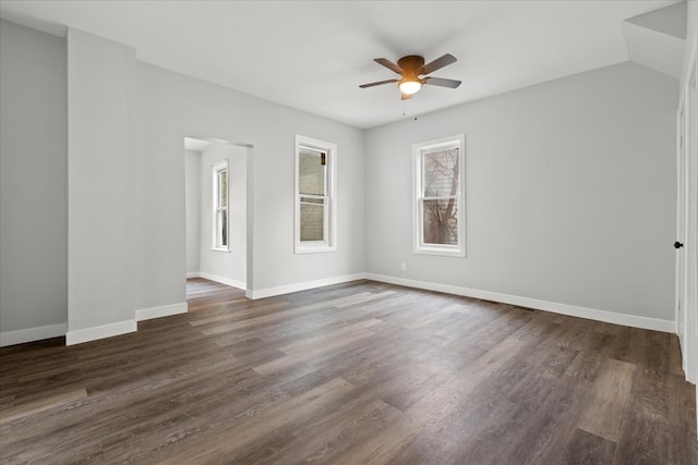 spare room with dark hardwood / wood-style floors and ceiling fan