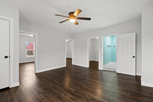 interior space with ceiling fan and dark hardwood / wood-style flooring