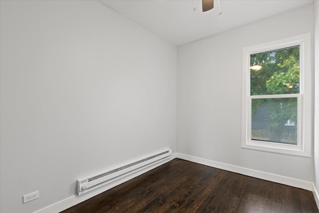 spare room with ceiling fan, hardwood / wood-style flooring, and a baseboard heating unit