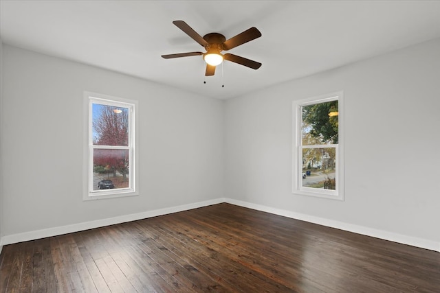 unfurnished room featuring dark hardwood / wood-style floors and ceiling fan