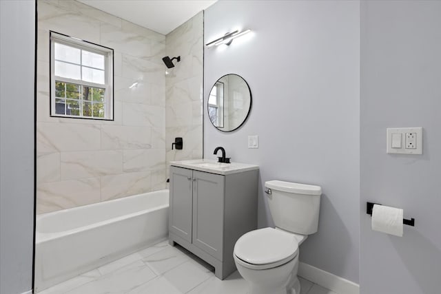 full bathroom with vanity, toilet, and tiled shower / bath