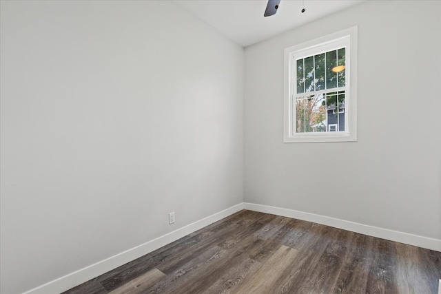 spare room featuring dark hardwood / wood-style floors and ceiling fan