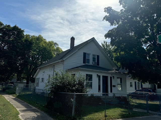 bungalow-style house with a front lawn