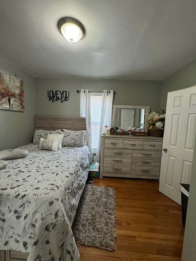 bedroom featuring dark hardwood / wood-style floors