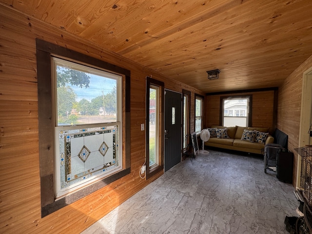 living room featuring wood walls, wooden ceiling, and hardwood / wood-style floors