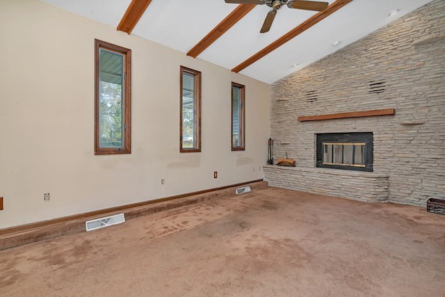 unfurnished living room with beam ceiling, ceiling fan, high vaulted ceiling, a fireplace, and carpet