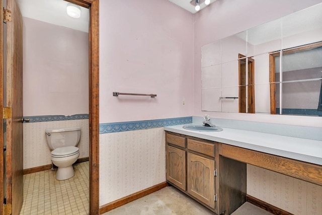 bathroom with vanity and toilet