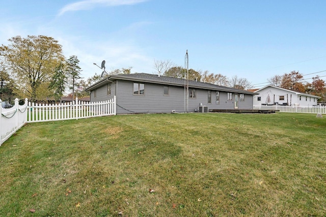 rear view of house with a yard