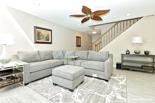 living room with hardwood / wood-style flooring and ceiling fan