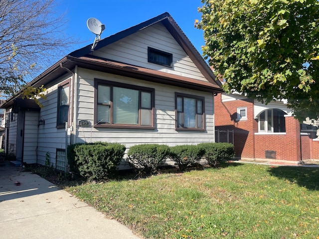 view of side of property with a yard