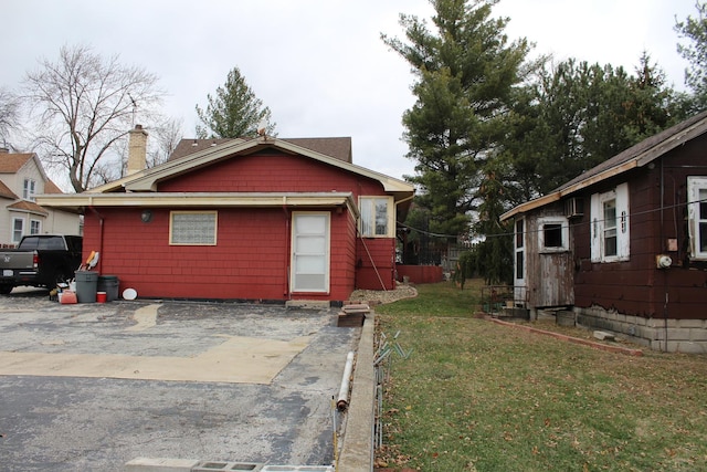 view of home's exterior featuring a patio area and a yard