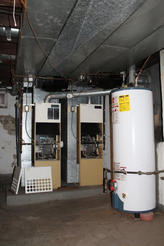 utility room featuring water heater